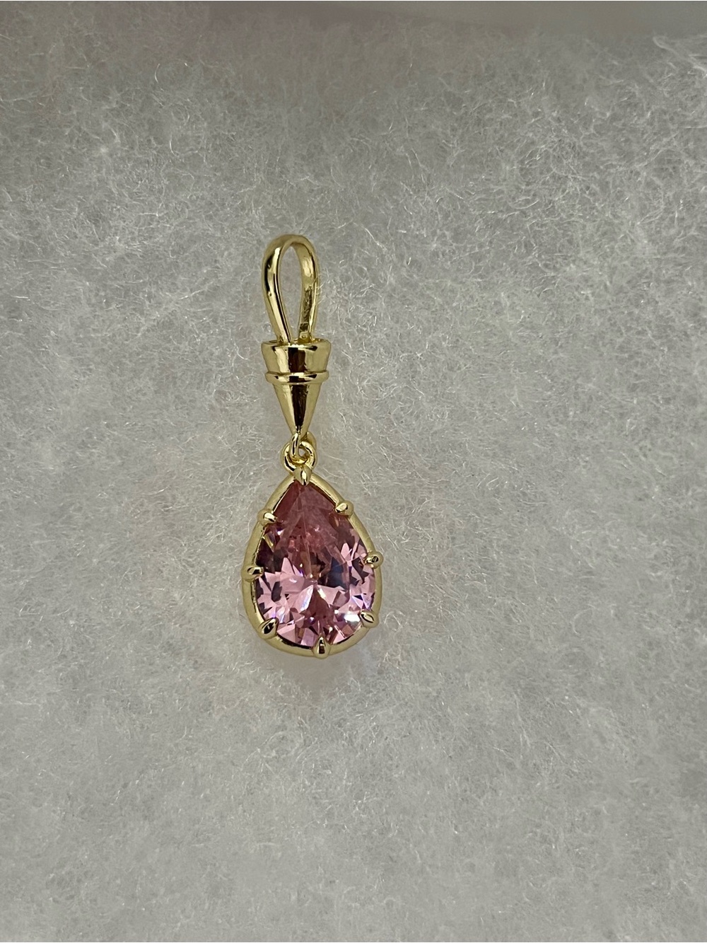 Pink cz pear-cut pendant in yellow gold-tone setting